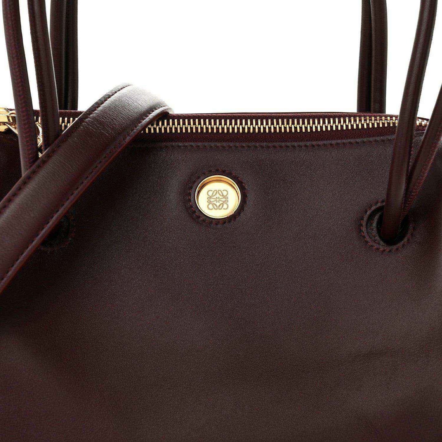 Loewe Small Madrid bag front close-up, Loewe logo medallion and top eyelets