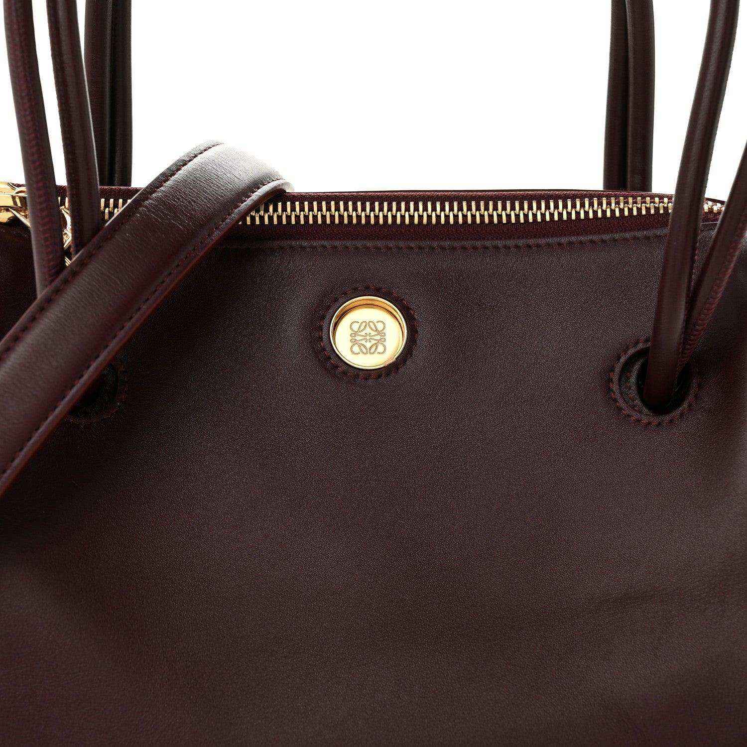 Loewe Small Madrid bag front close-up, Loewe logo medallion and top eyelets