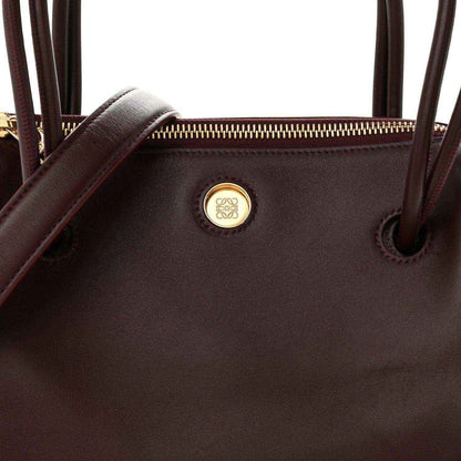 Loewe Small Madrid bag front close-up, Loewe logo medallion and top eyelets