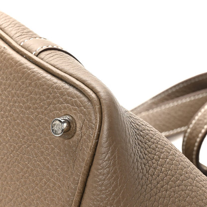 Taupe leather tote bag strap corner with round snap stud