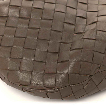 Taupe woven leather hobo bag exterior close-up with Intrecciato weave at bottom edge