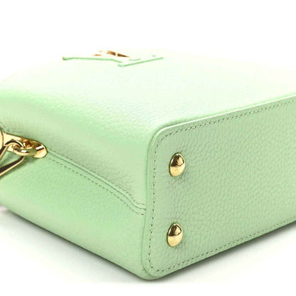 Green leather mini handbag corner with two gold snap studs