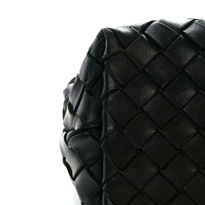 Black leather shoulder bag with intrecciato nappa weave and rounded side
