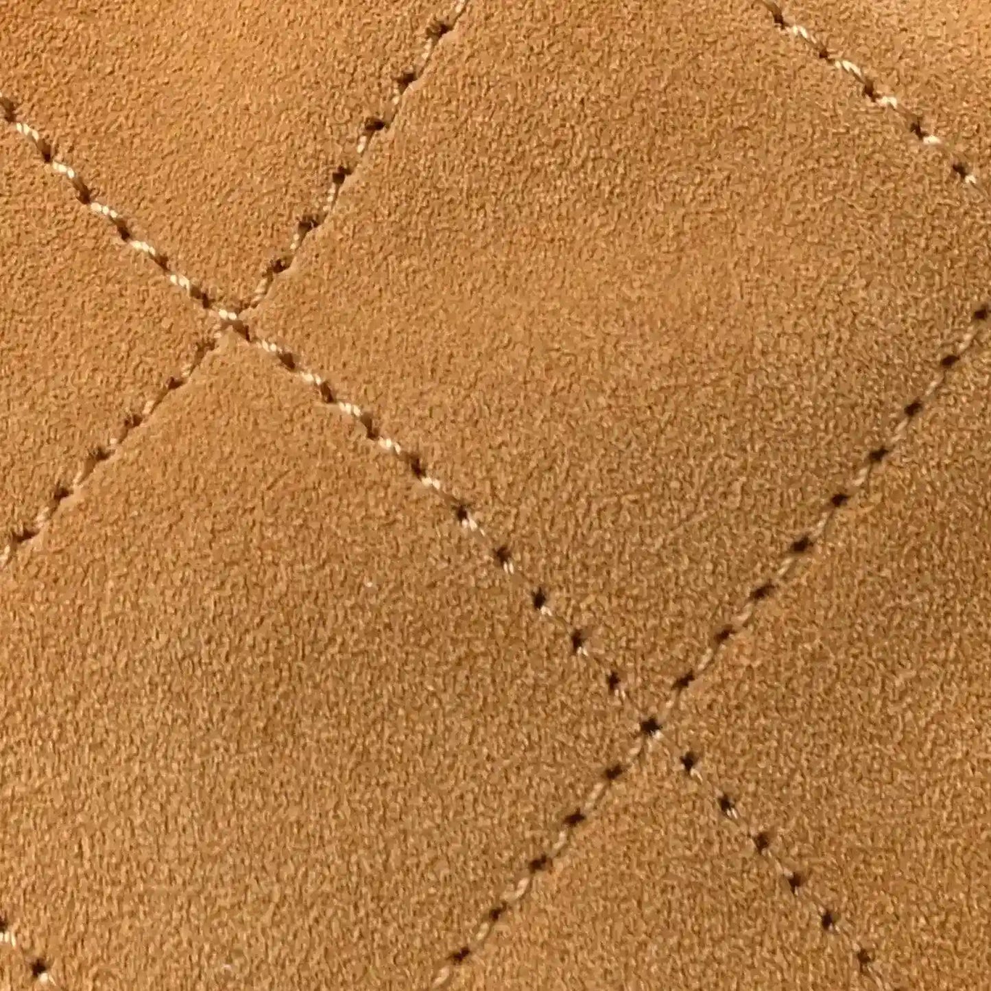Chanel suede quilted surface with visible crosshatch stitching in classic beige