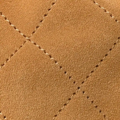 Chanel suede quilted surface with visible crosshatch stitching in classic beige