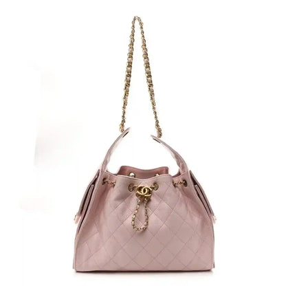 Chanel light pink quilted caviar small shoulder handbag with gold chain handles