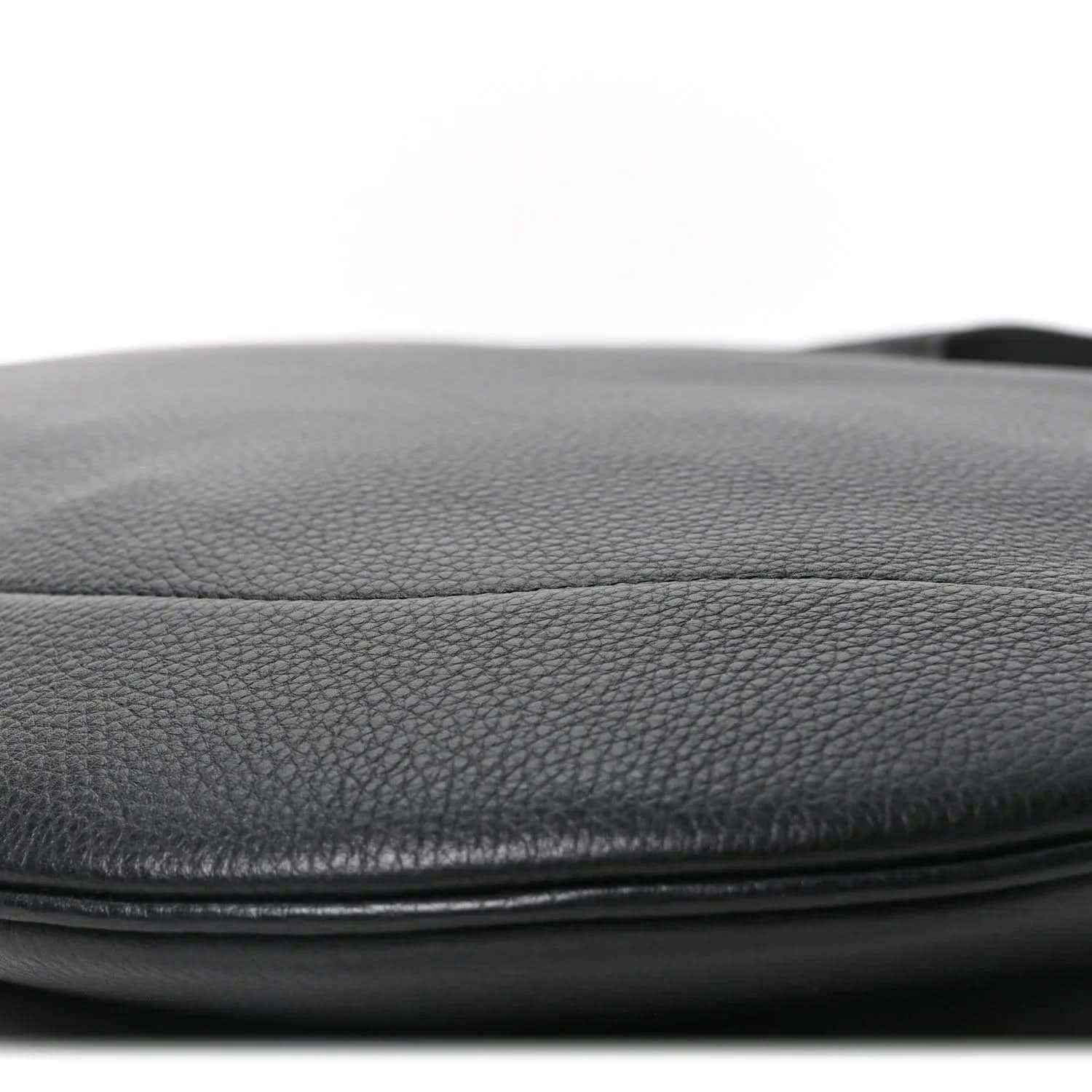 Black grained leather bag edge with smooth pebble texture