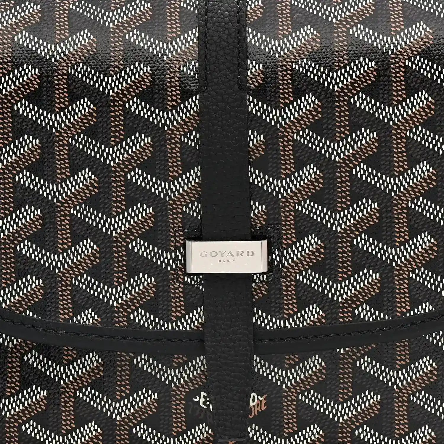 Black jacquard messenger bag with vertical strap and Goyard label on the flap