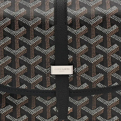 Black jacquard messenger bag with vertical strap and Goyard label on the flap