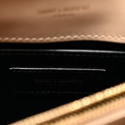 Inside leather label with embossed Saint Laurent text and dark trim