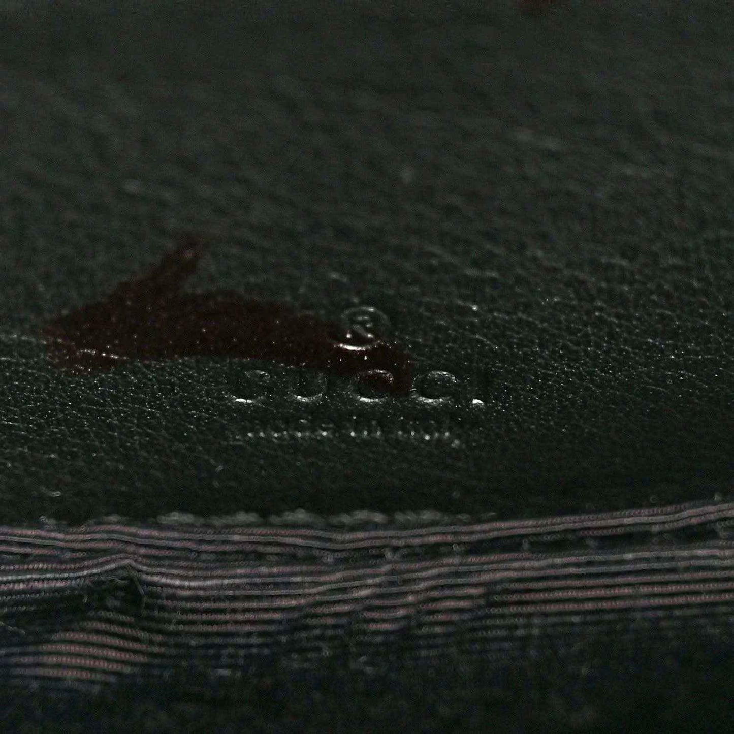 Leather lining with Gucci logo emboss in dark green-black finish