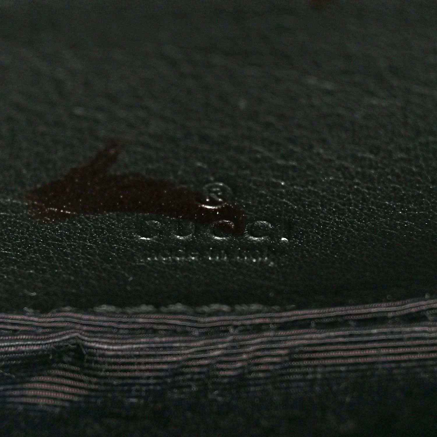 Leather lining with Gucci logo emboss in dark green-black finish