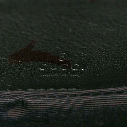 Leather lining with Gucci logo emboss in dark green-black finish