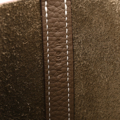 Etoupe leather seam detail with contrast white stitching