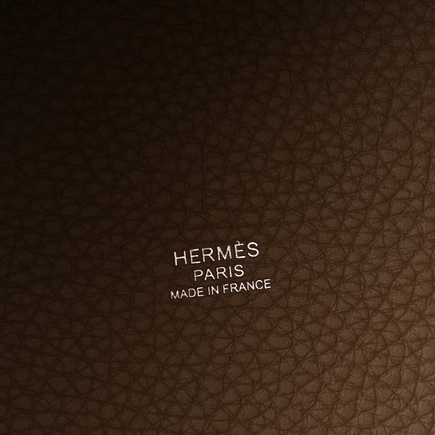 Leather bag lining with HERMES PARIS MADE IN FRANCE text