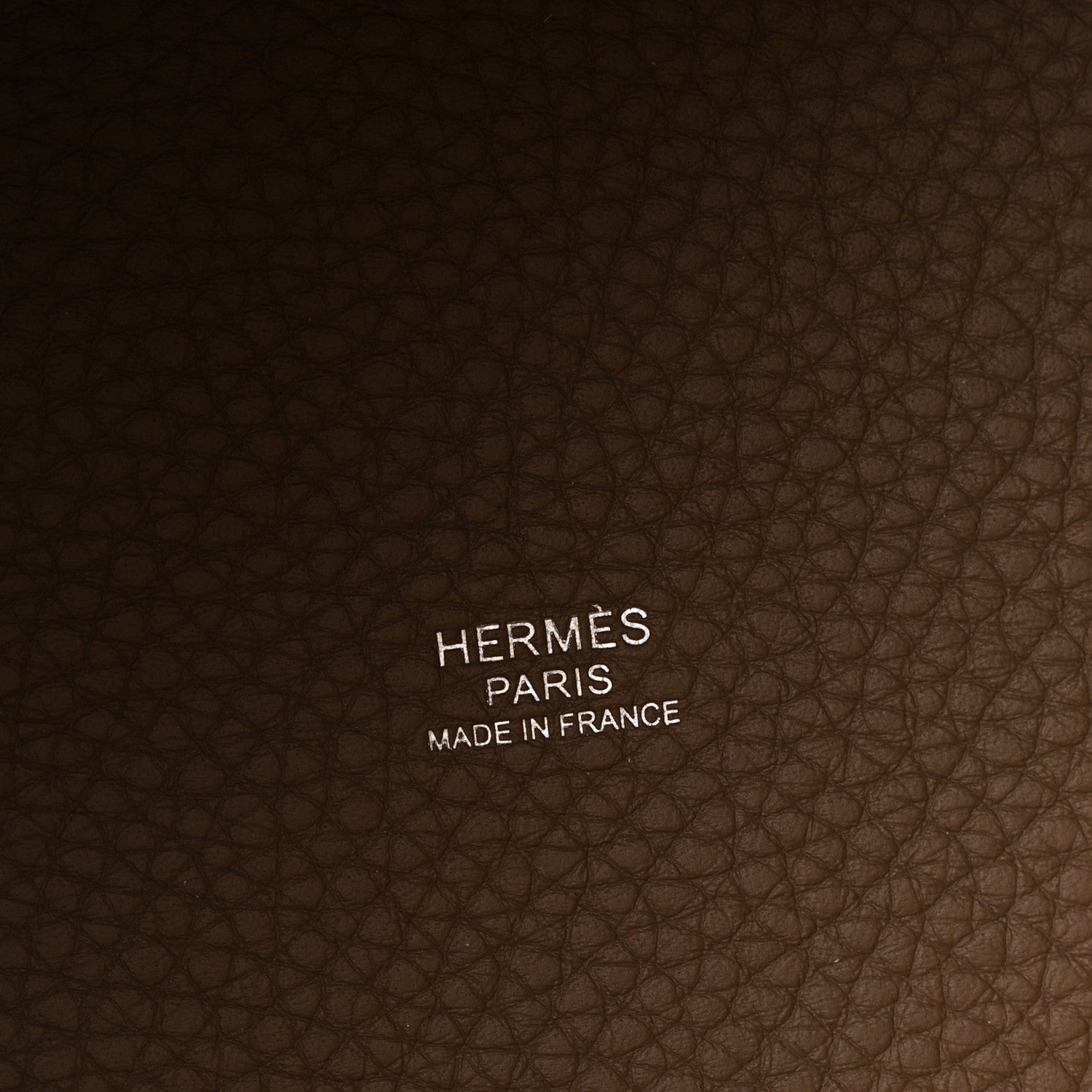 Leather bag lining with HERMES PARIS MADE IN FRANCE text