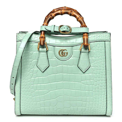 Green alligator-pattern small tote bag with bamboo-style handles and gold-tone GG clasp