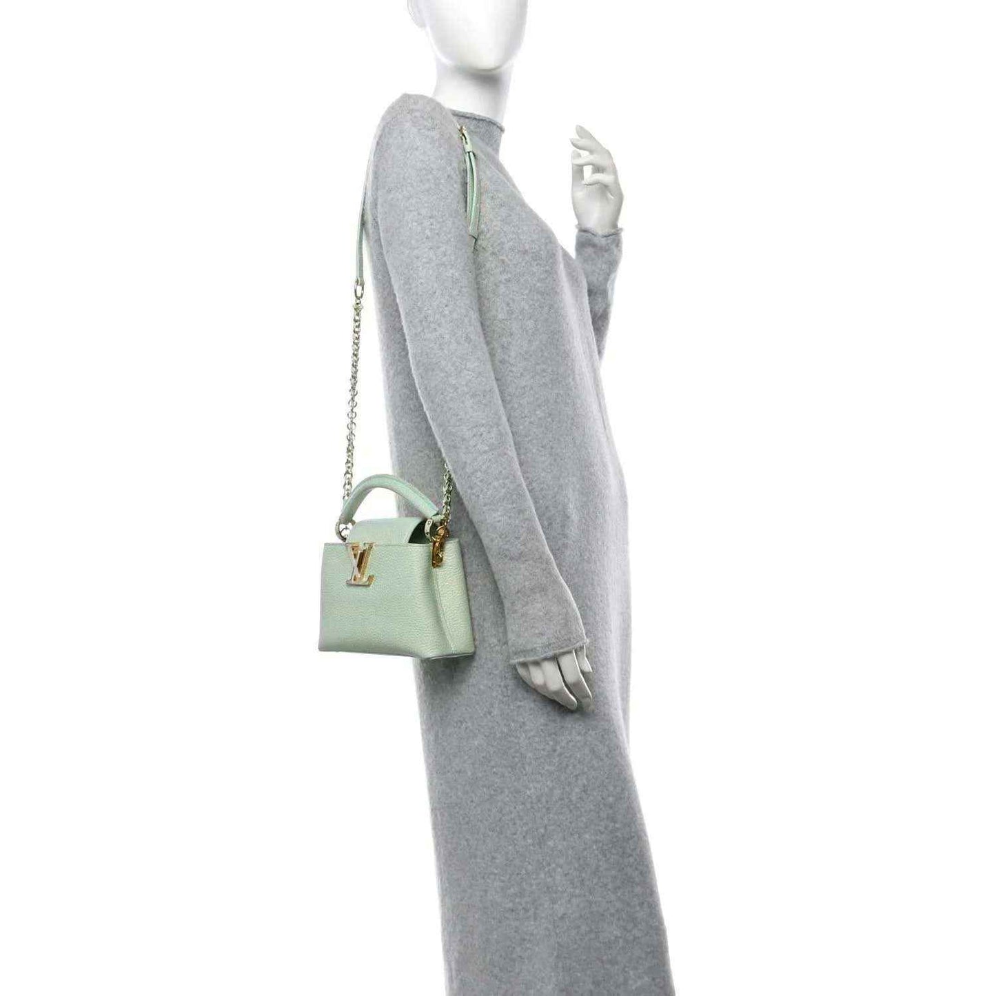 Mini Capucines handbag in light green with gold chain crossbody strap