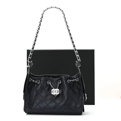 Quilted mini handbag with chain strap, front CC charm, and top handles