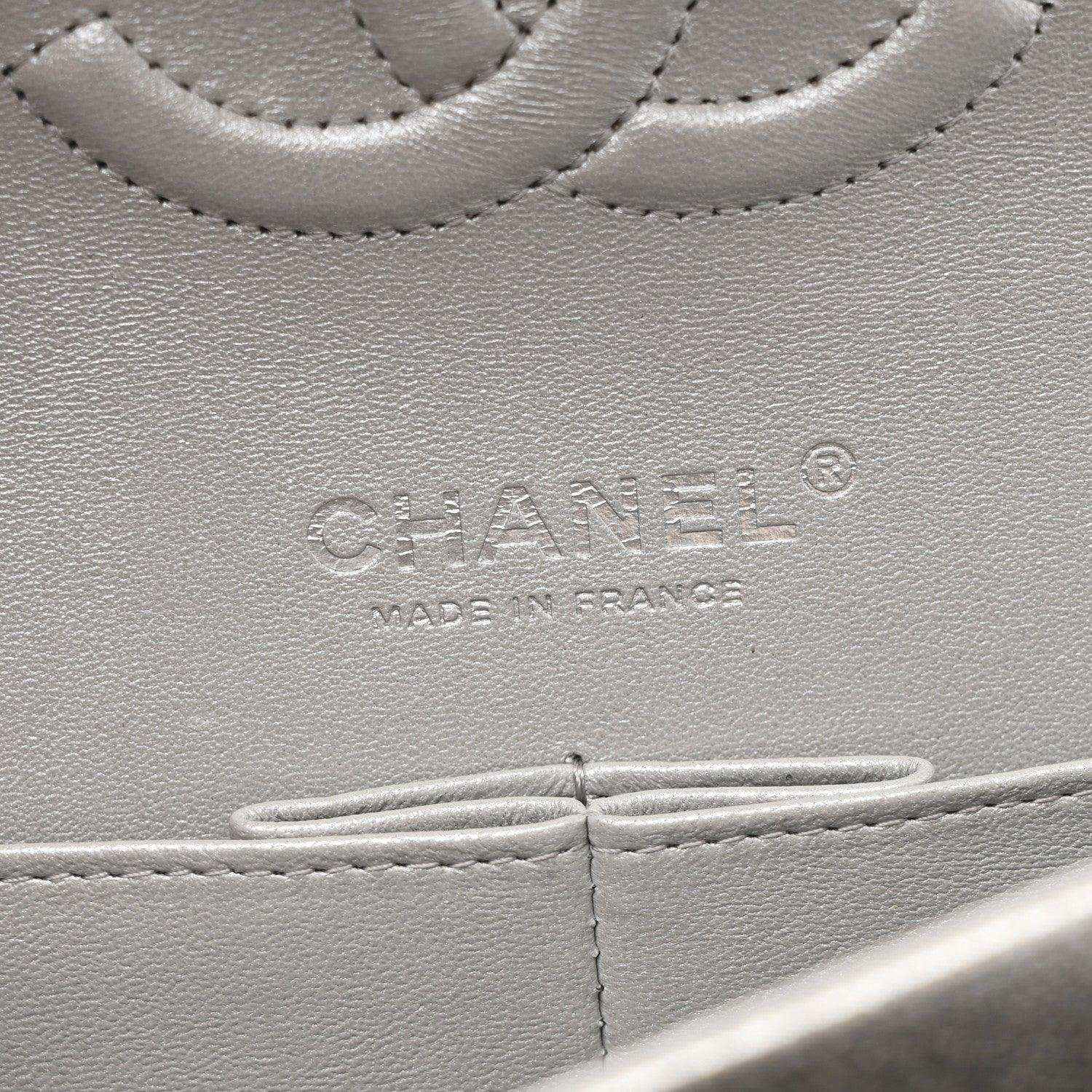 Chanel stamped leather panel close-up on silver metallic double flap bag