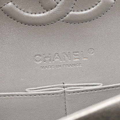 Chanel stamped leather panel close-up on silver metallic double flap bag