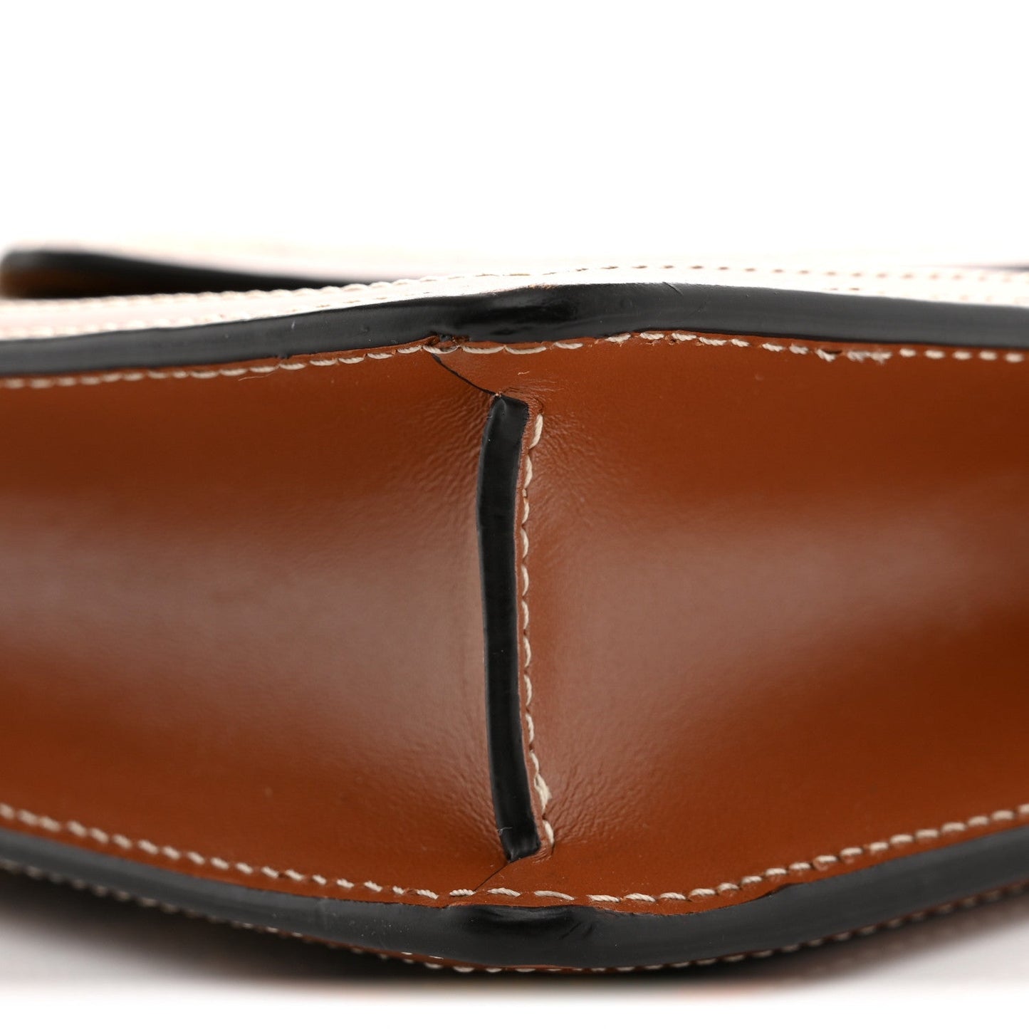 Tan leather wallet on chain, close-up of flap seam and contrast stitching