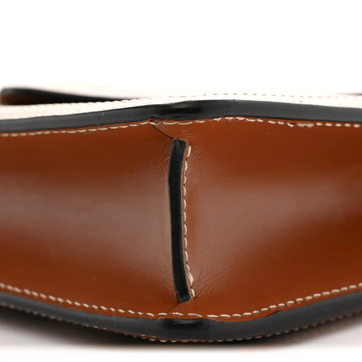 Tan leather wallet on chain, close-up of flap seam and contrast stitching