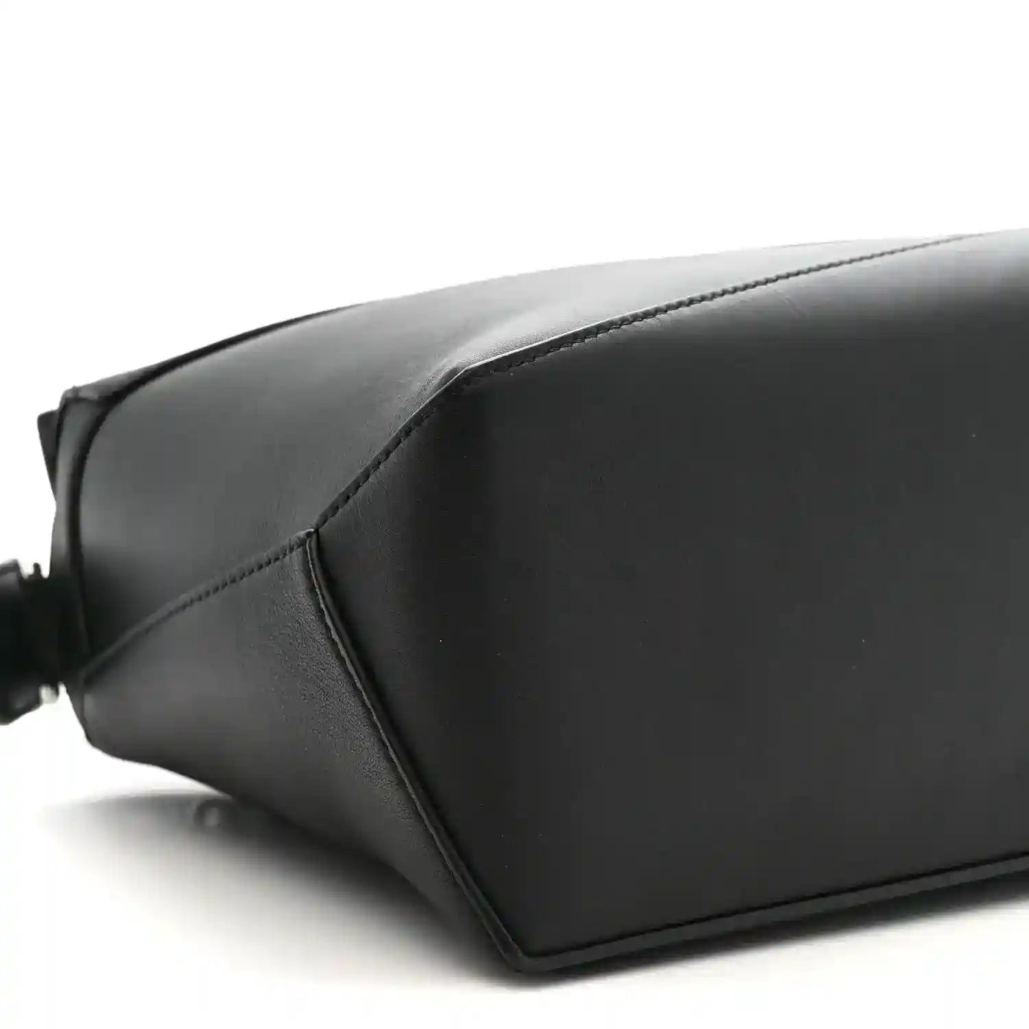 Small Puzzle Edge shoulder bag in black leather with smooth panels and stitched seams