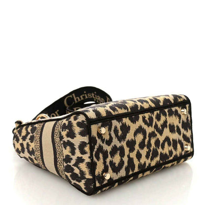 Christian Dior leopard canvas bag end view with metal stud details
