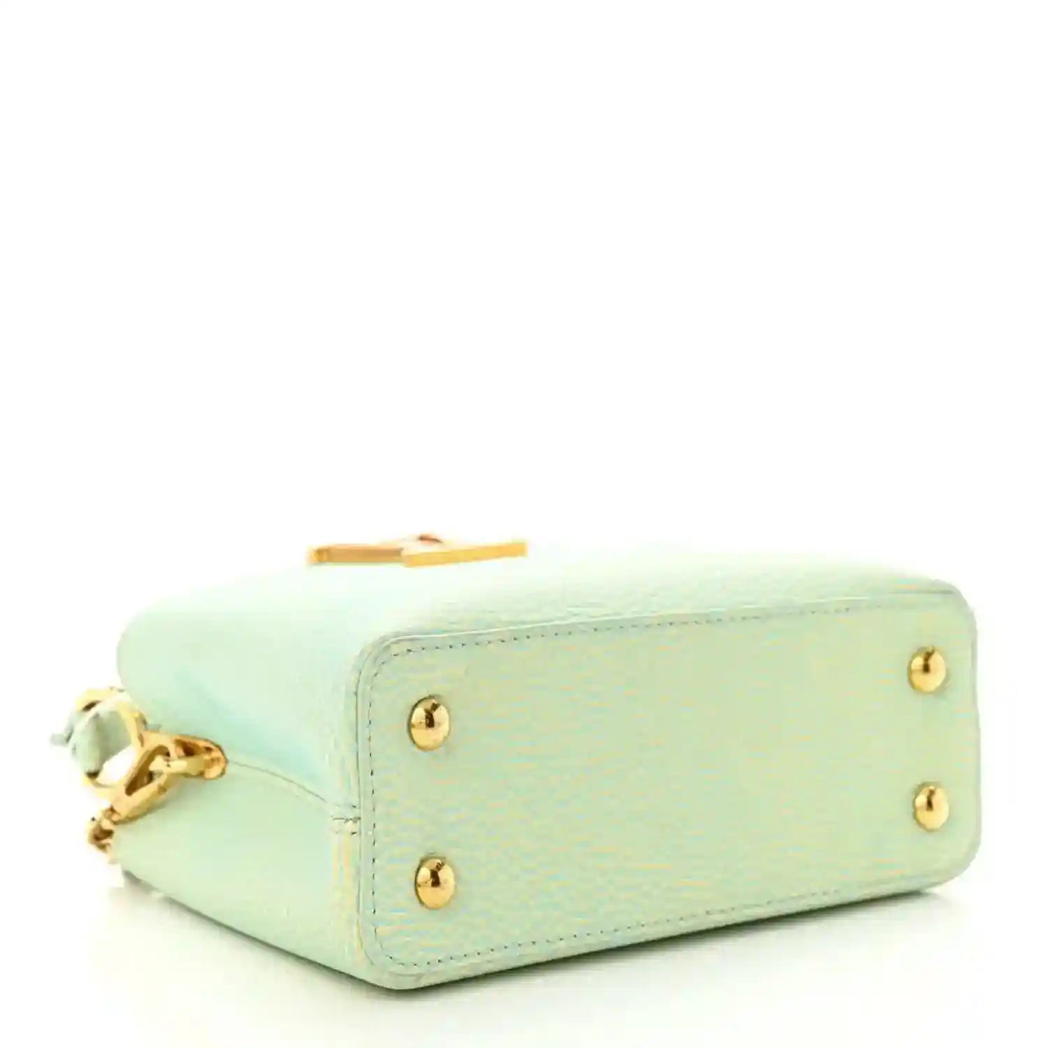 Mini Capucines handbag in light green textured leather with gold feet and hardware