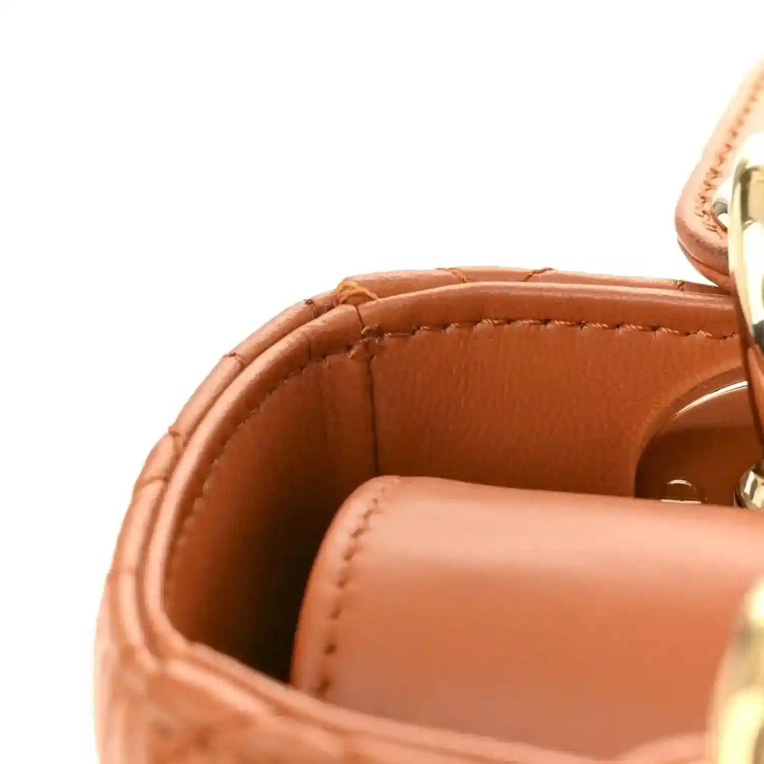 Small tote interior in orange lambskin with stitched top rim and gold hardware