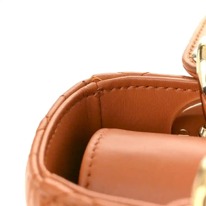 Small tote interior in orange lambskin with stitched top rim and gold hardware