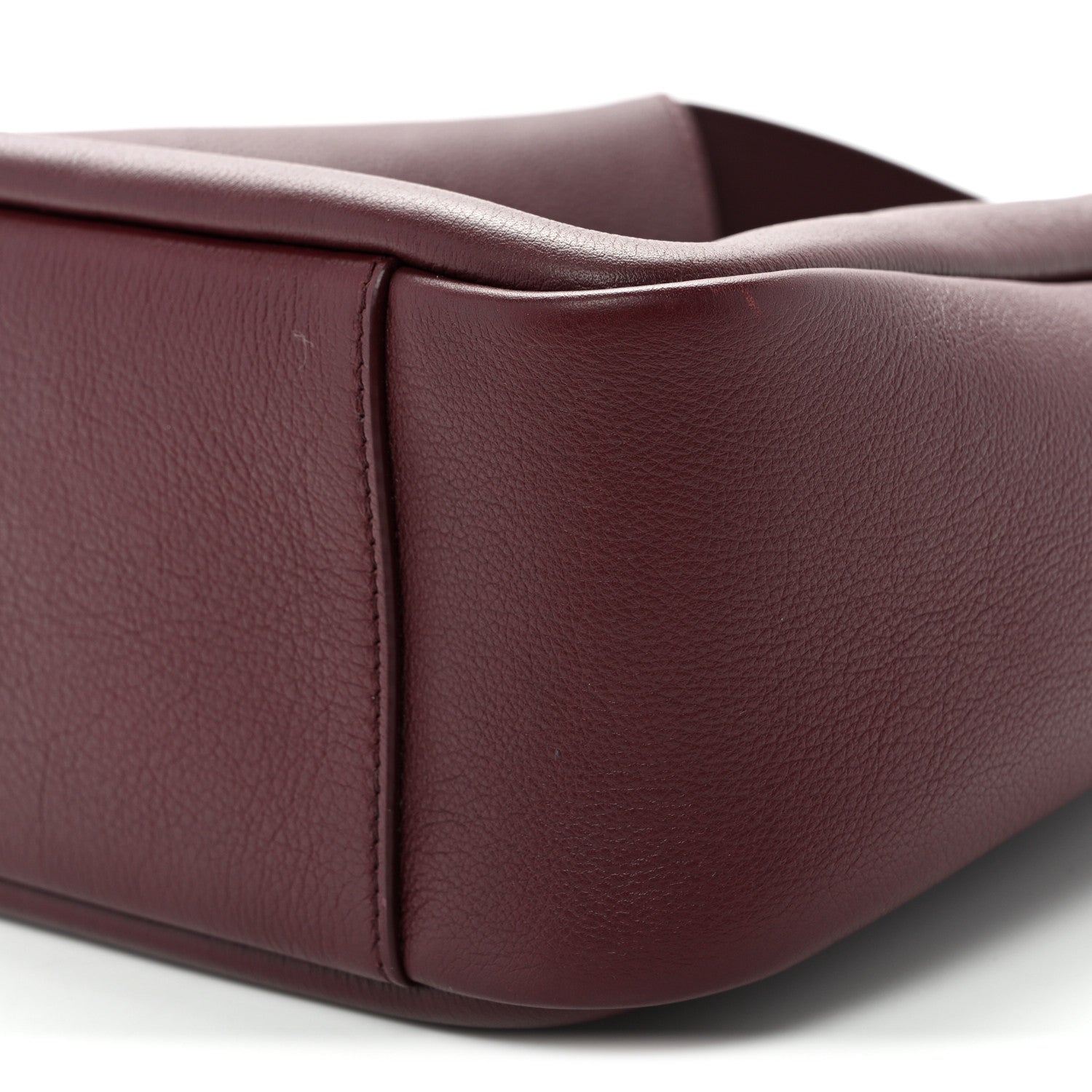 Burgundy smooth calfskin hobo bag side panel with corner seam detail