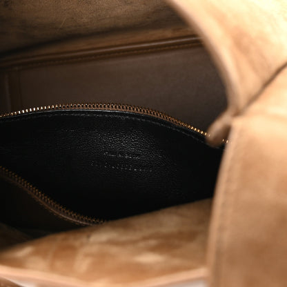 Suede hobo bag interior view with gold zipper track and dark lining