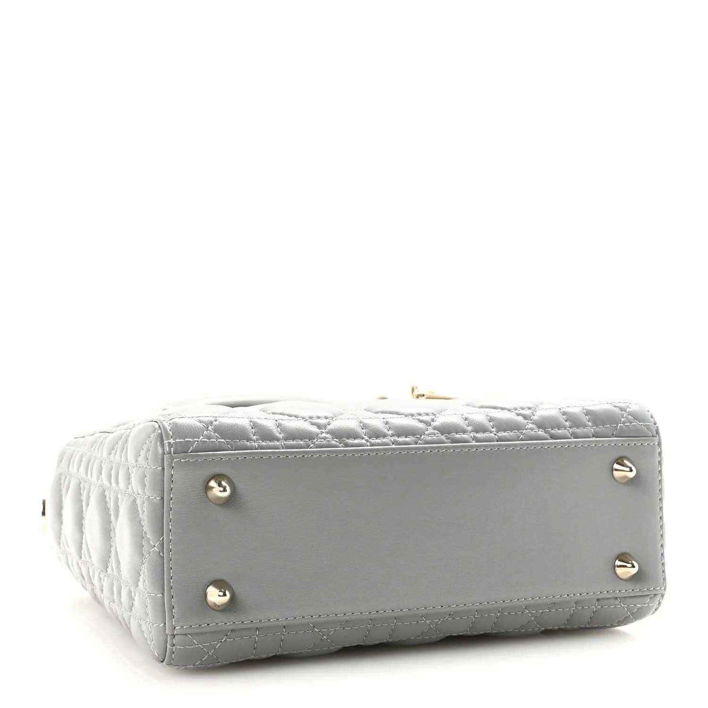 Grey quilted Lady Dior handbag with gold studs on the structured bottom