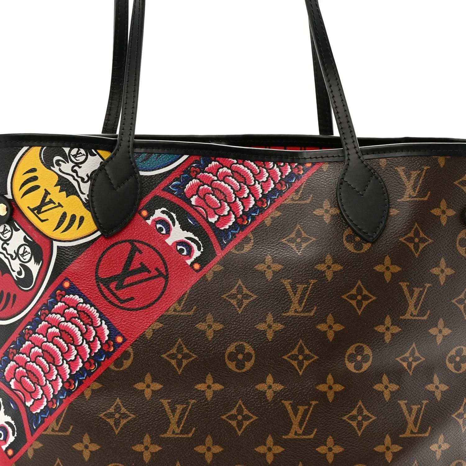 Tote top view, black leather handles and colorful owl-style patch on brown monogram