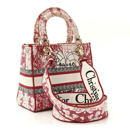 Medium Lady D-Lite handbag with charm, red and white embroidered canvas, side view