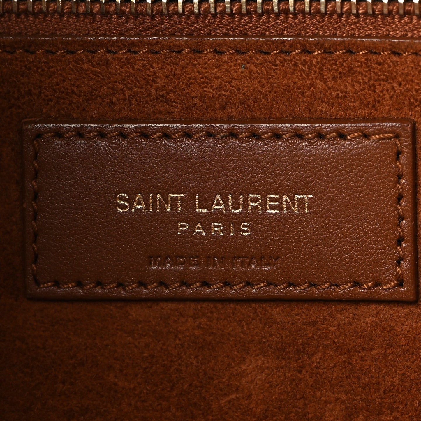 SAINT LAURENT PARIS leather brand patch on brown interior lining