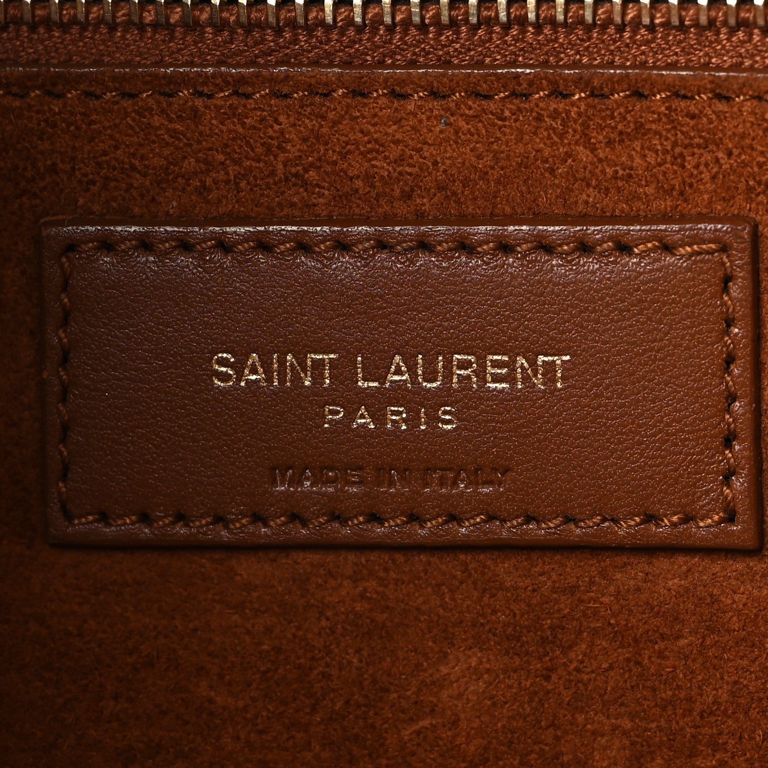 SAINT LAURENT PARIS leather brand patch on brown interior lining