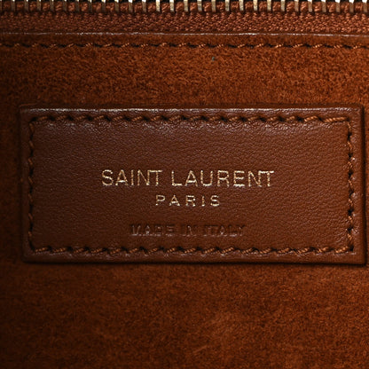 SAINT LAURENT PARIS leather brand patch on brown interior lining