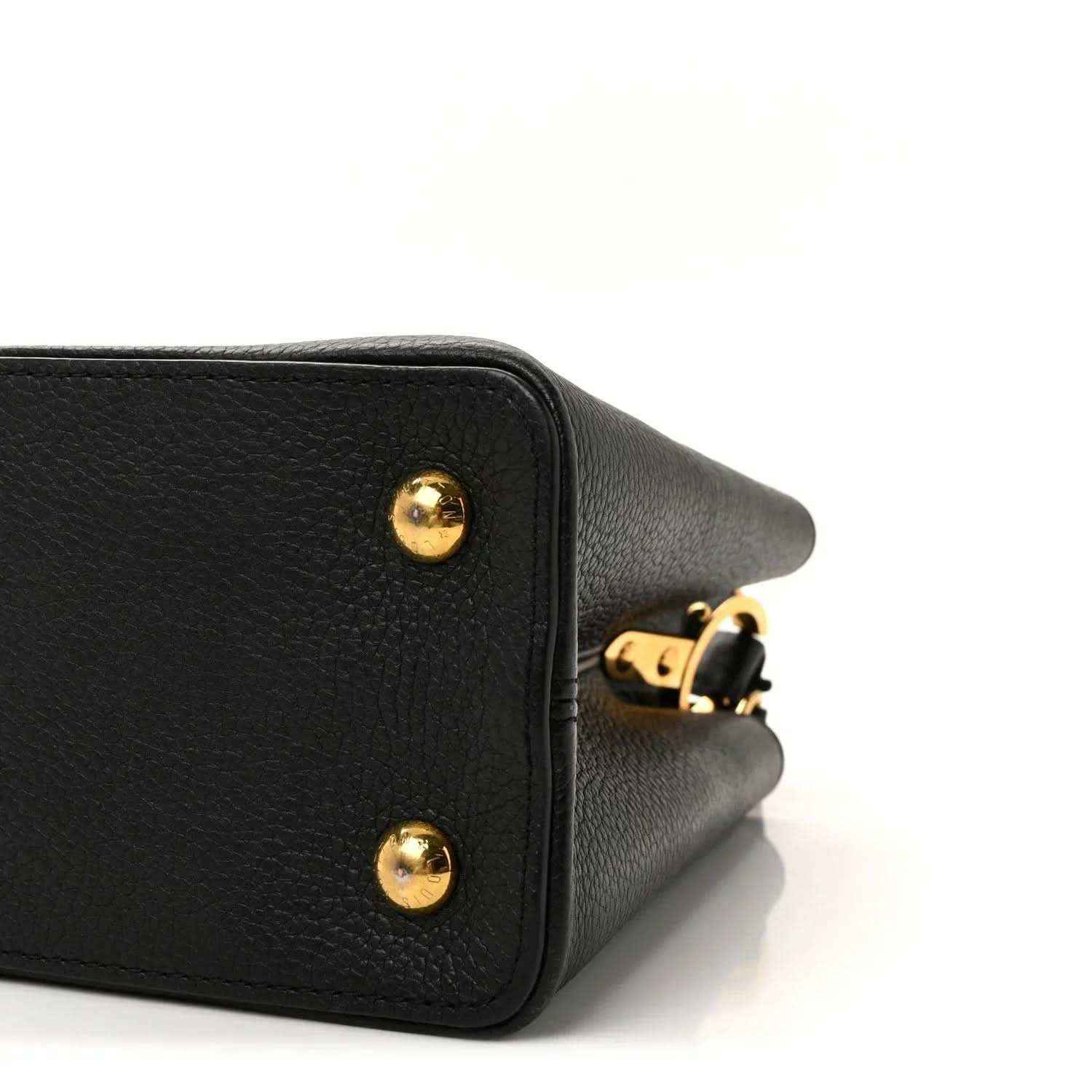 Louis Vuitton Capucines BB bag corner close-up with gold stud and strap attachment