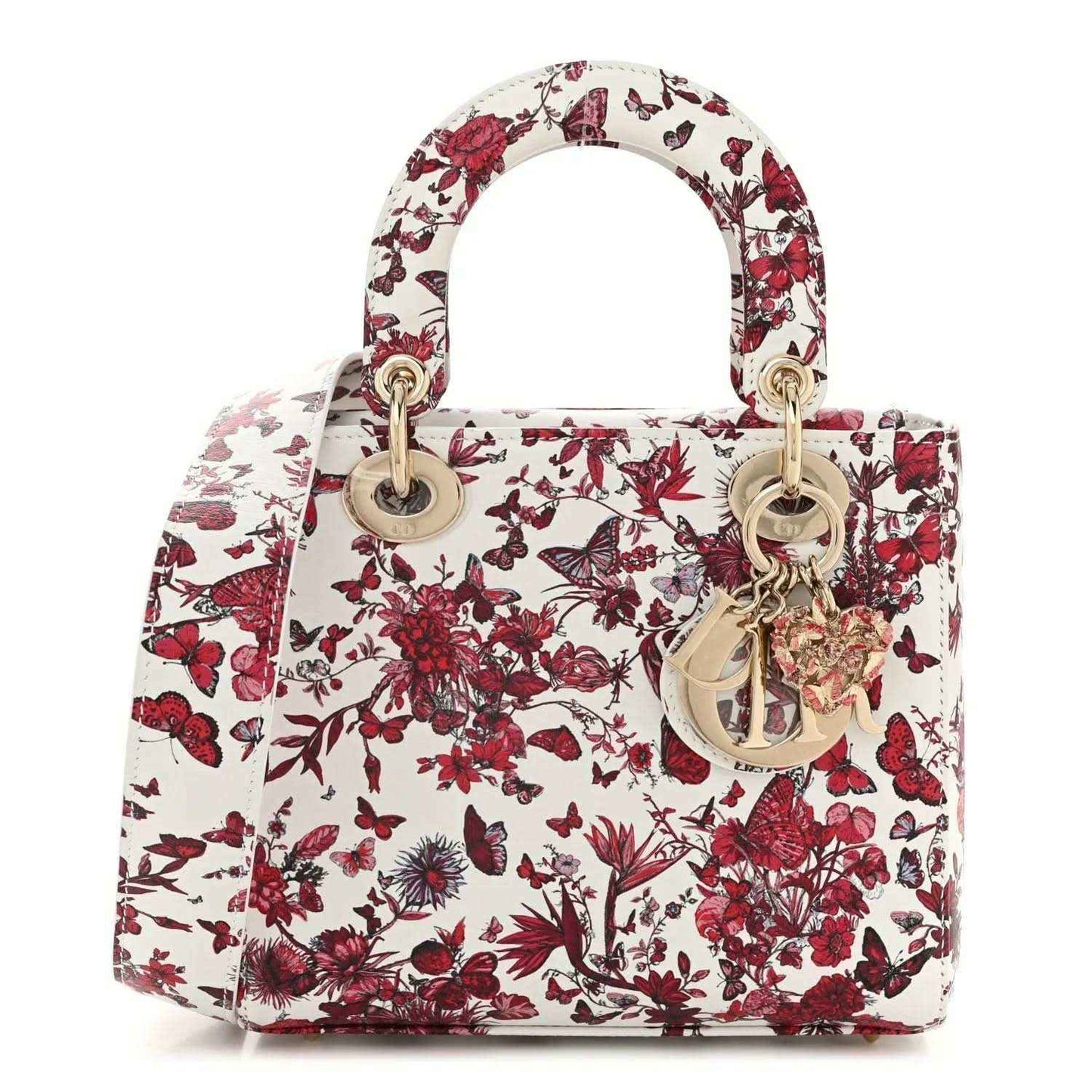 Small structured handbag in white with red floral print, gold-tone top handles and hardware