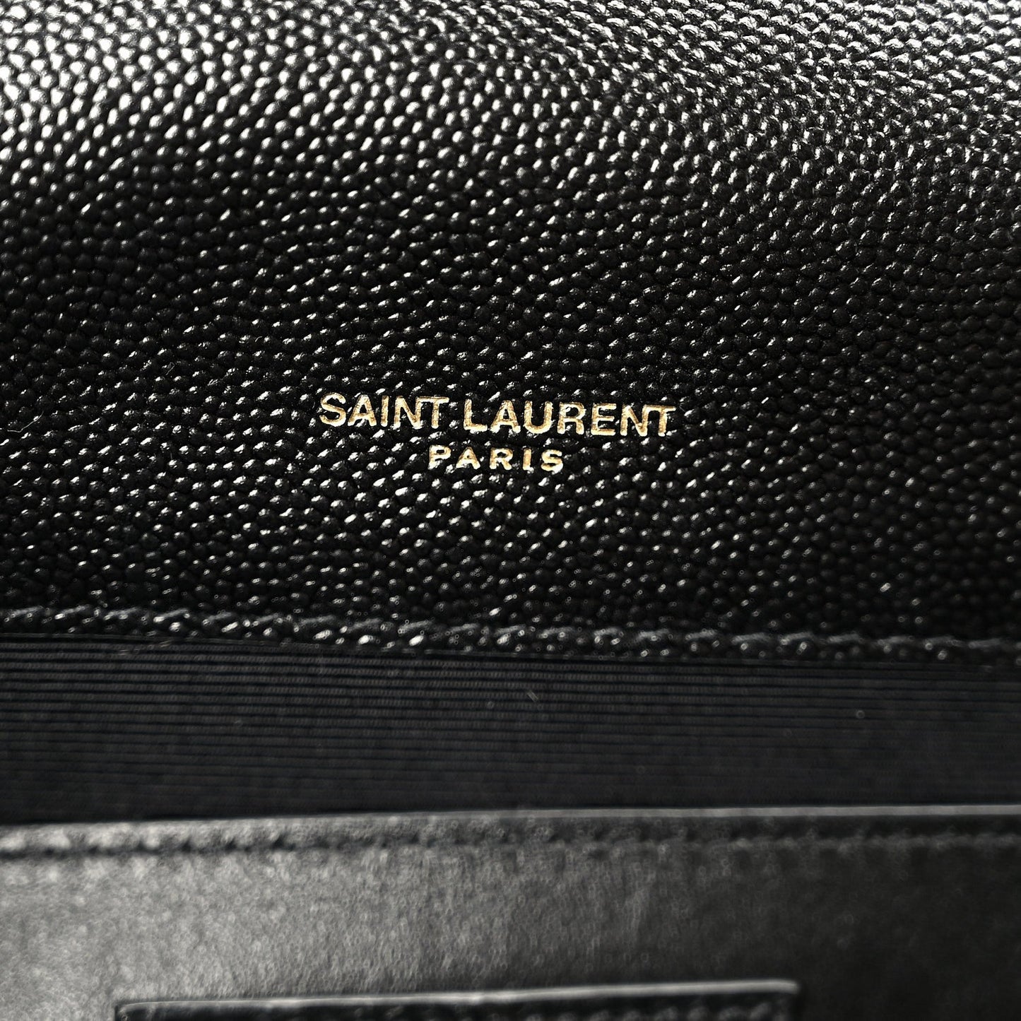 Black leather satchel with “SAINT LAURENT PARIS” embossing