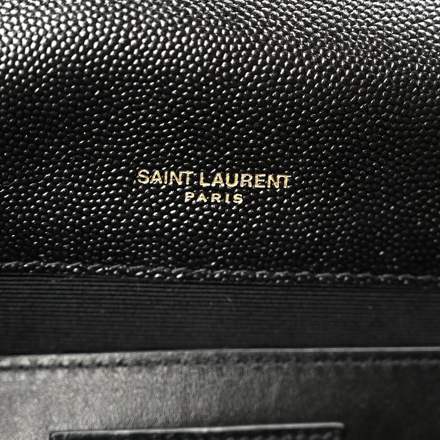 Black leather satchel with “SAINT LAURENT PARIS” embossing