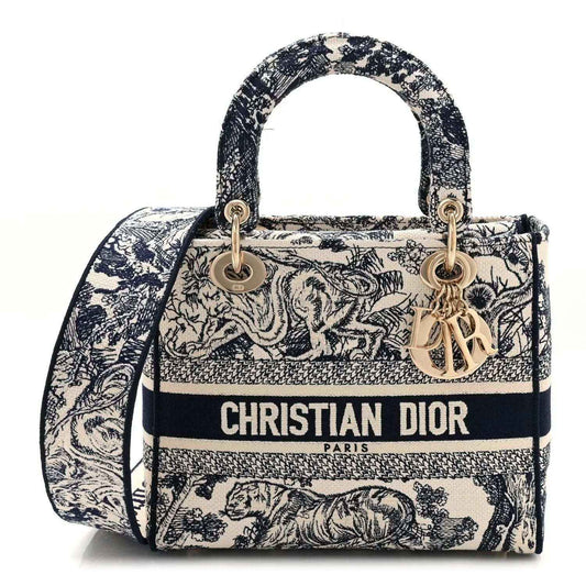 Blue toile de Jouy embroidered handbag with top handles, gold hardware, and Dior logo front.