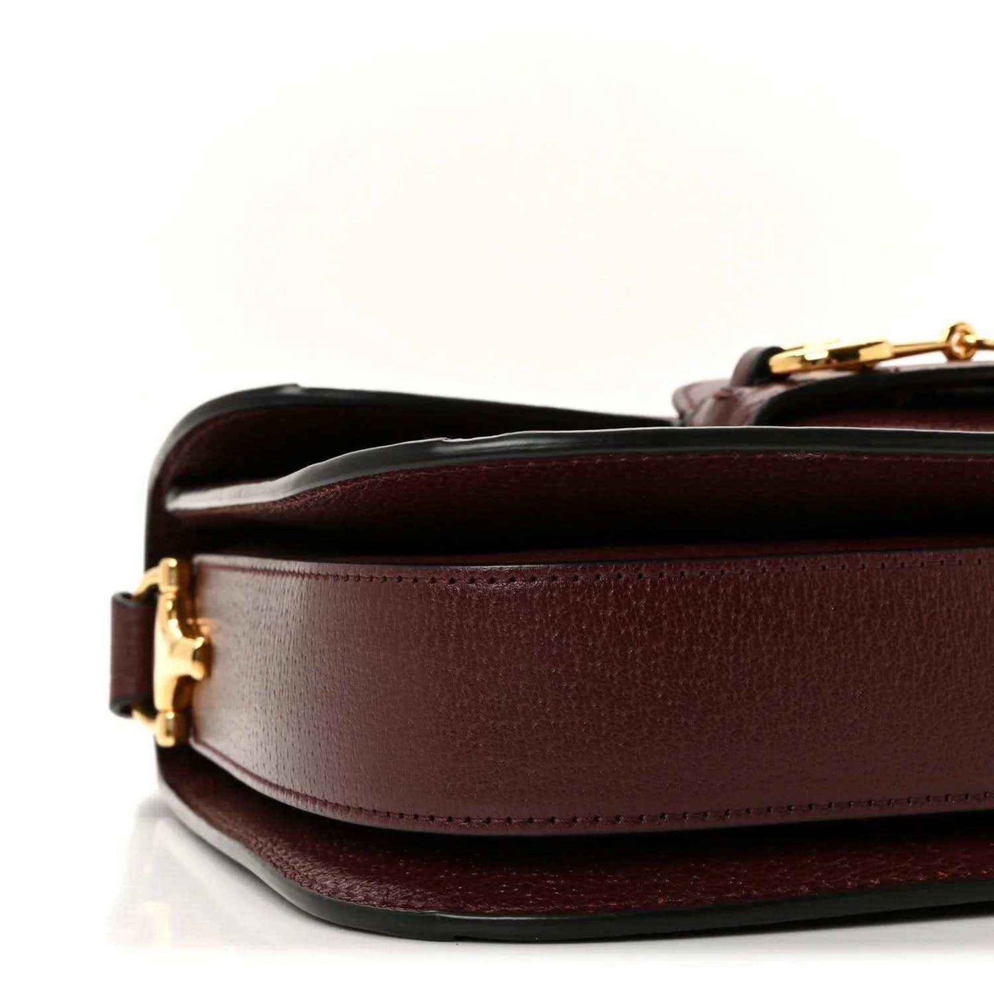 Gucci shoulder bag side view with burgundy leather body and gold-tone hardware