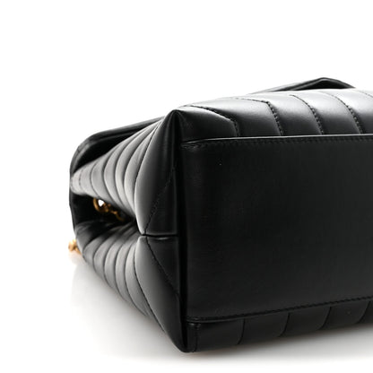 Black quilted calfskin satchel side with structured base and stitched edges