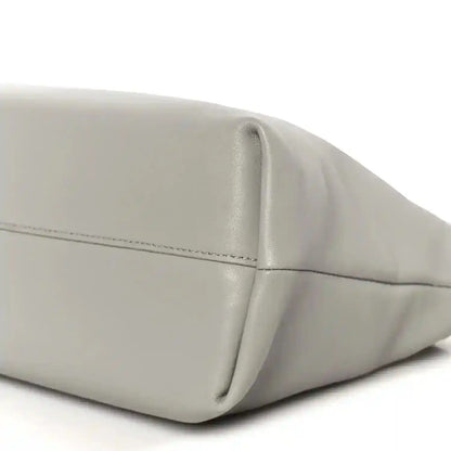 Loewe clutch bag in light grey with rounded base seam and smooth leather finish