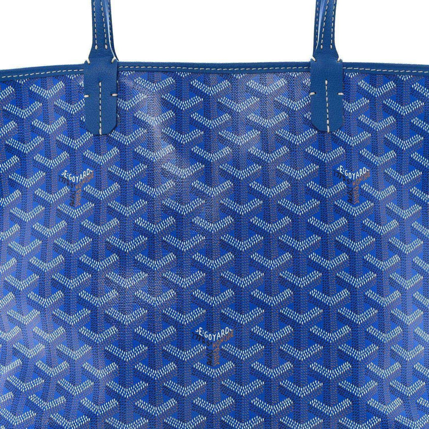 Close-up of sky blue tote bag front panel with repeating Goyardine-style pattern
