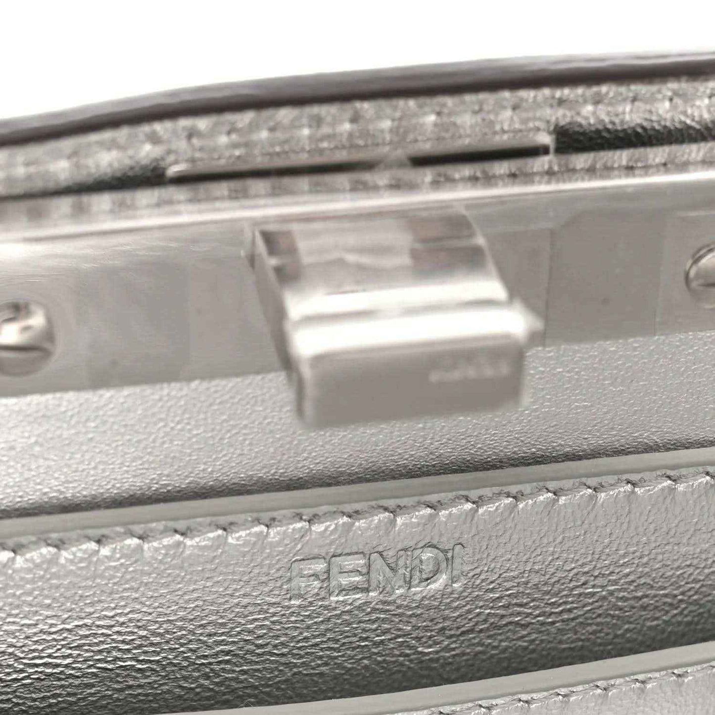 Silver satchel clasp plate with stitched leather trim and FENDI embossing